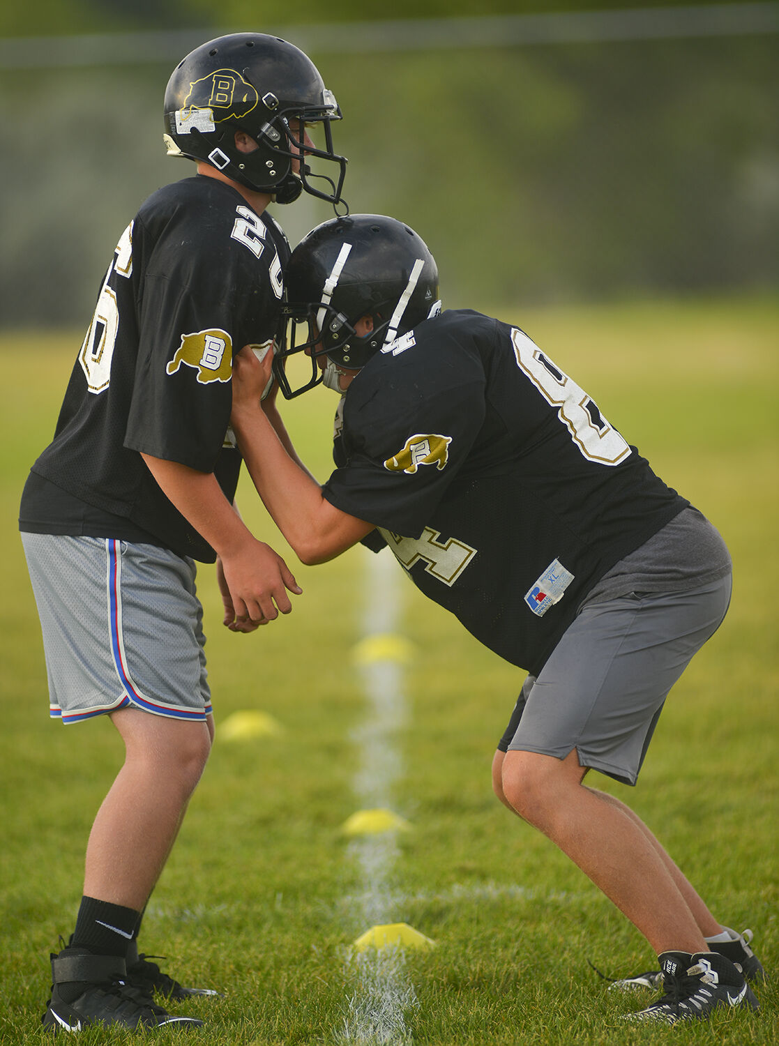 Brogan Byram, right, sets up for a drill against partner Lance Rabel